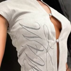 The Embroidered Suede High-Neck Top: Sand Beige Short Sleeve Blouse with Frog Button Detail Copy