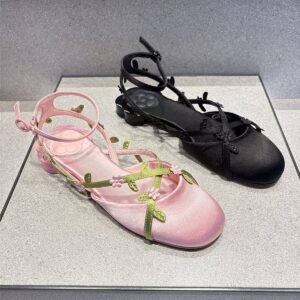 Pair of floral vine satin ballet flats in pink and black colors side by side